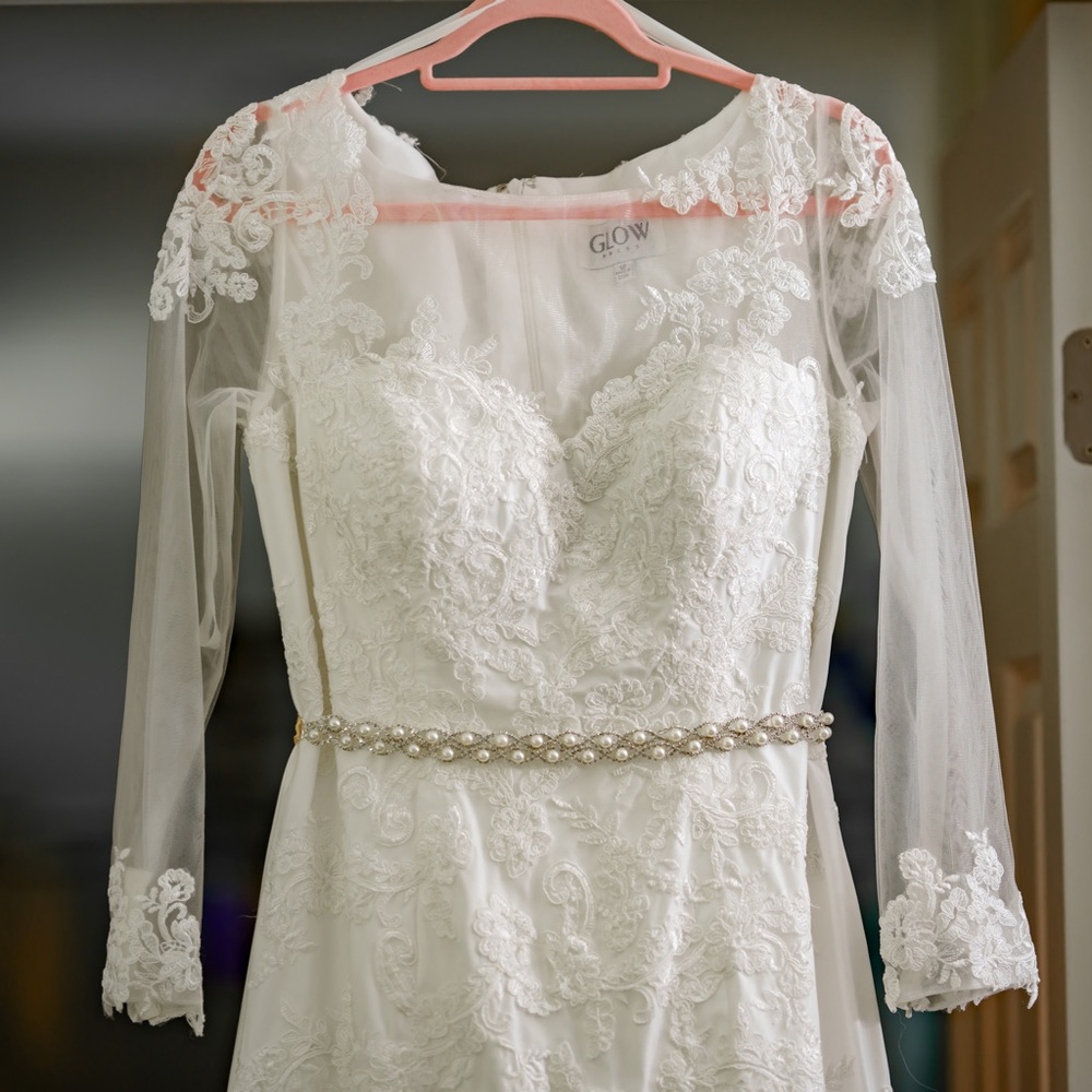 Off white wedding dress. Size 12. Includes belt.